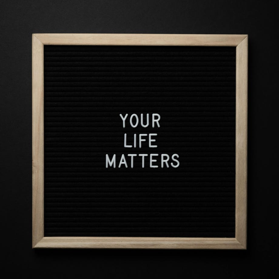 Blackboard with YOUR LIFE MATTERS inscription on black background